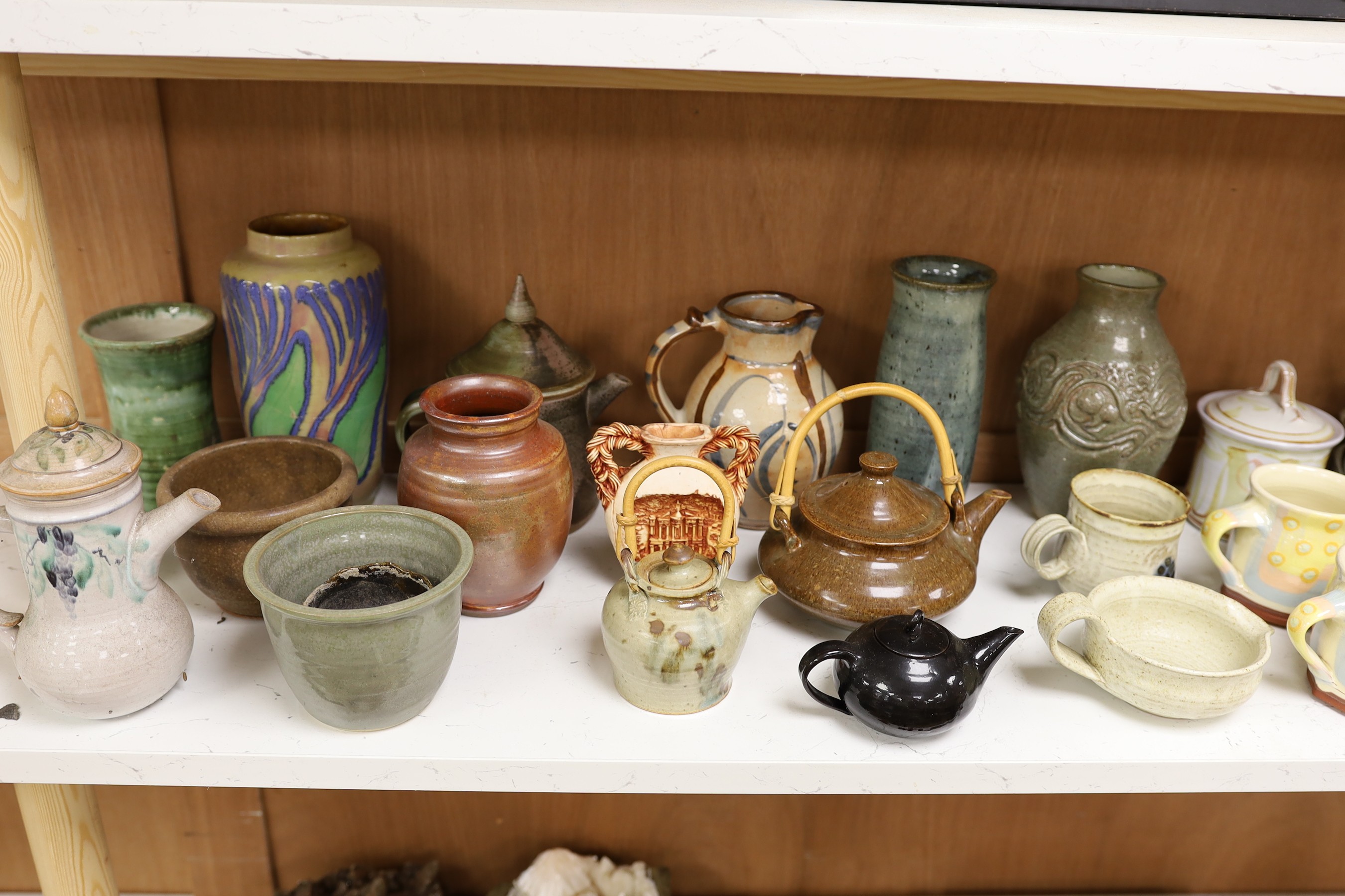 A large quantity of British studio pottery teapots, mugs, jugs and other miscellaneous items, to include a vast amount by Susan Threadgold